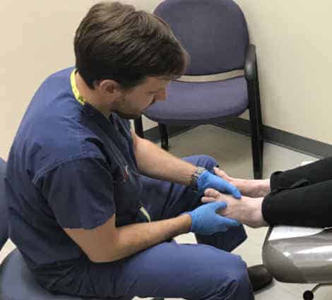 Doctor checking foot